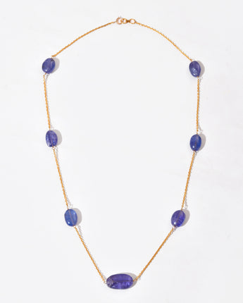 Necklace with purple gemstones on a white background
