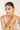 Woman wearing a bracelet on a plain background