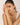 Woman with a pearl bracelet on a plain background