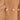 Pearl bracelet on a wrist with a neutral background
