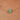 Gold necklace with a green bead on a person's neck