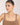 Woman wearing a necklace against a plain background