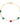 Gold bracelet with green and red gemstones on a white background