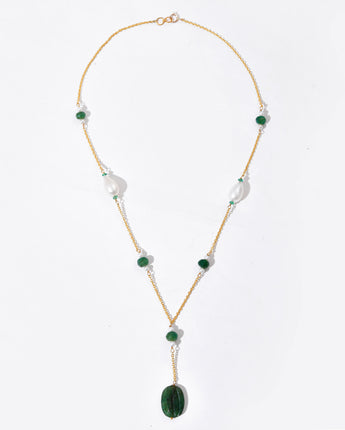 Necklace with green and white beads on a white background
